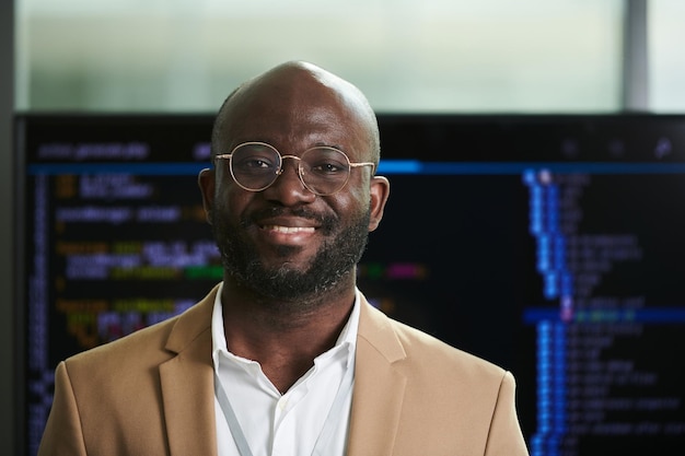 Young smiling African American businessman in eyeglasses and formalwear