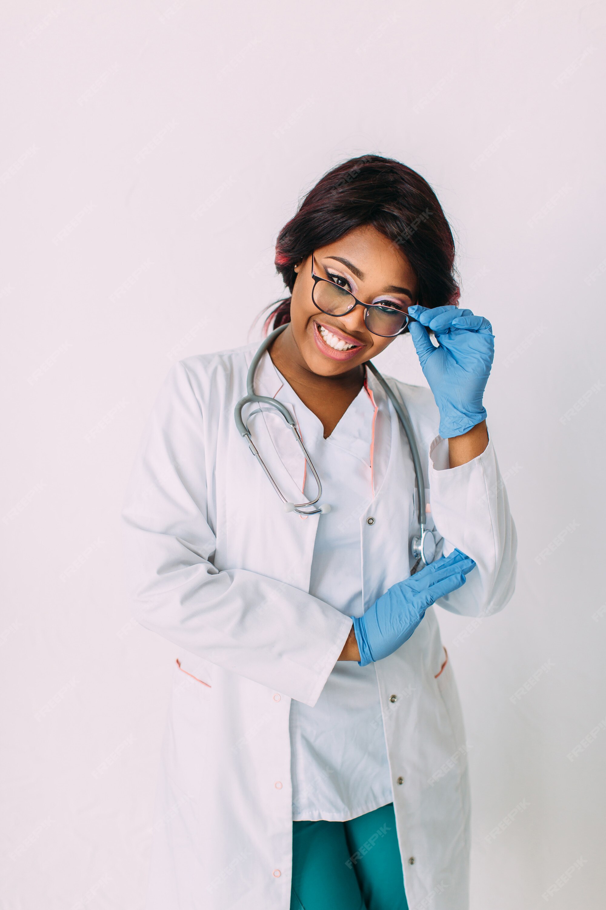 Premium Photo | Young smiling african american woman doctor in medical  gloves and clothes, isolated on white
