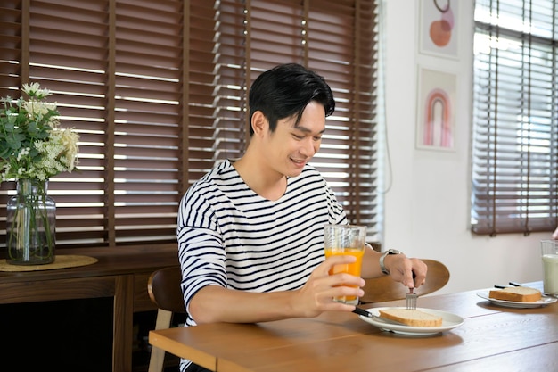 Young smiling asian man having meal on the table family conceptx9