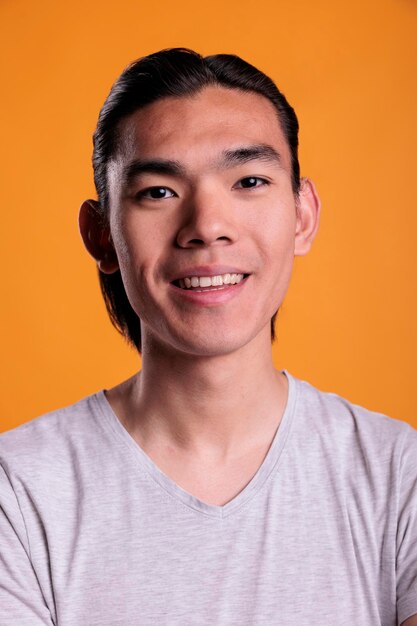 Young smiling asian man portrait closeup person
