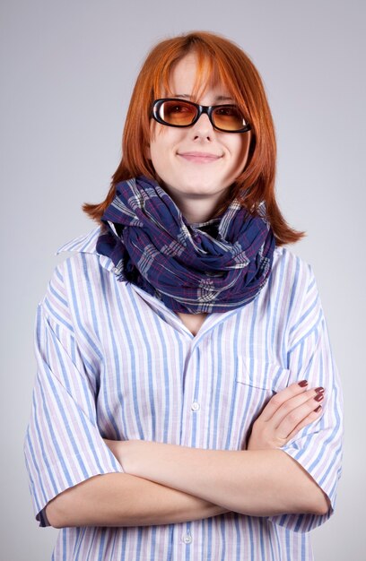 Young  smiling fashion girl in glasses