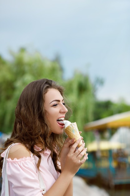 Young smiling girl with ice cream