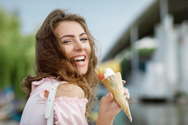 Young smiling girl with ice cream