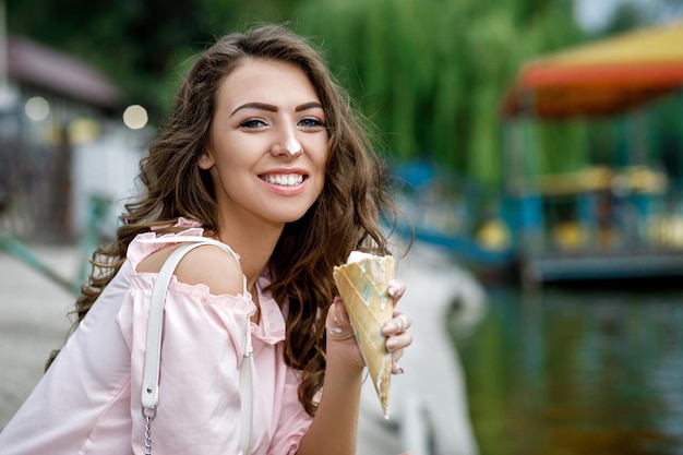 Young smiling girl with ice cream