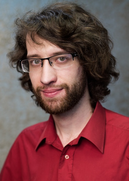 Young smiling man in glasses