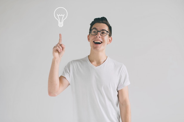 Young smiling man having a good idea