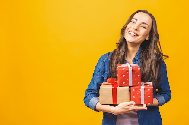 Young smiling model hold gift box