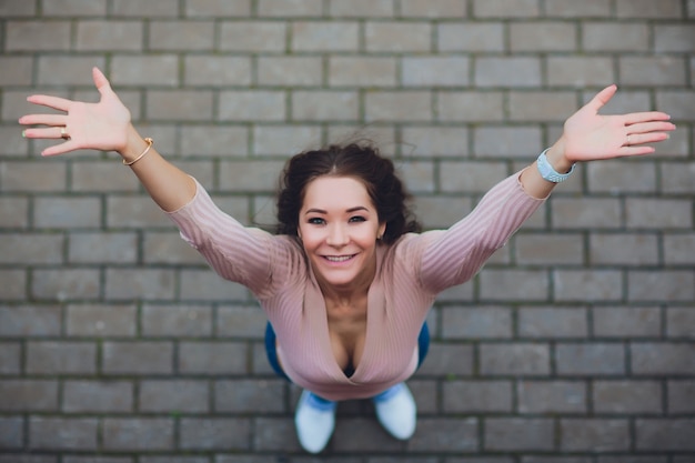 Young smiling teen girl. Shot from above.