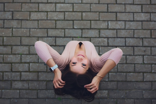 Young smiling teen girl. Shot from above.