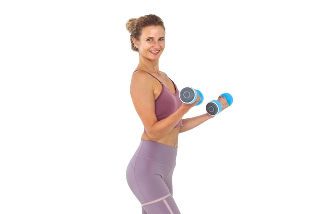 Young smiling woman exercising with dumbbells in hands isolated on white background