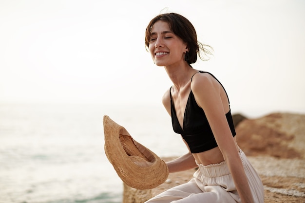 Young smiling woman outdoors portrait at beach