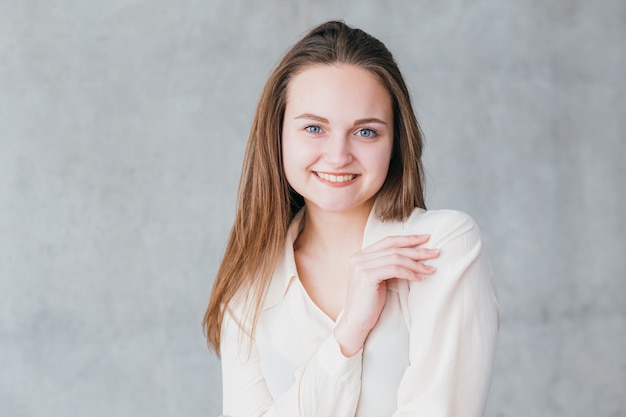 Young smiling woman portrait. Business career start