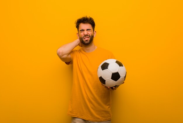Young soccer player man suffering neck pain