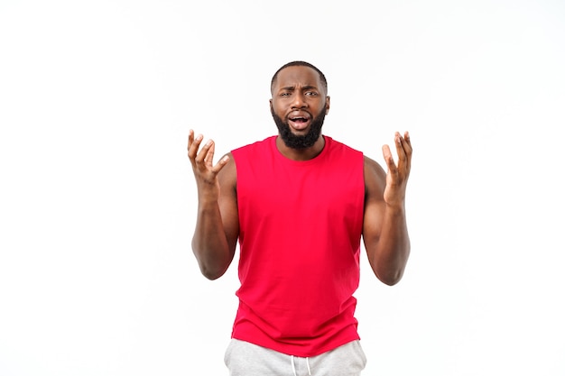 Young sport african american man pleading isolate over grey background.