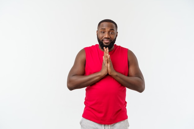 Young sport african american man pleading isolate over grey.