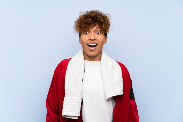 Young sport african american man with surprise facial expression