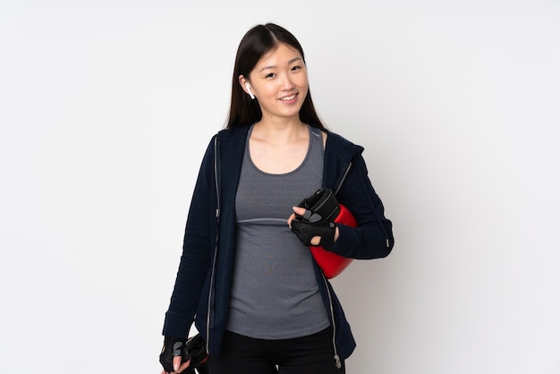 Young sport asian woman isolated on white with boxing gloves