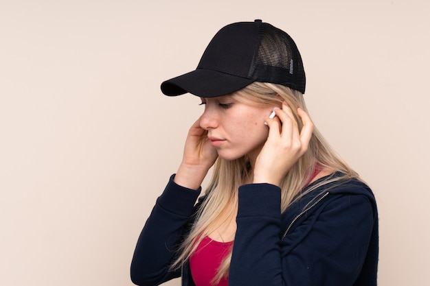 Young sport blonde woman listening music