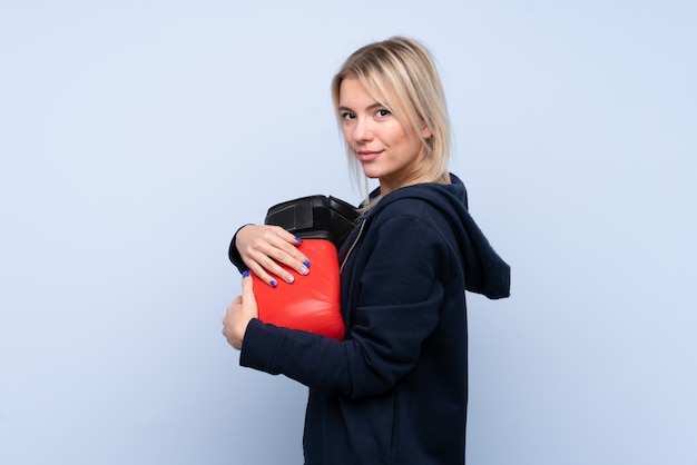 Young sport blonde woman with boxing gloves