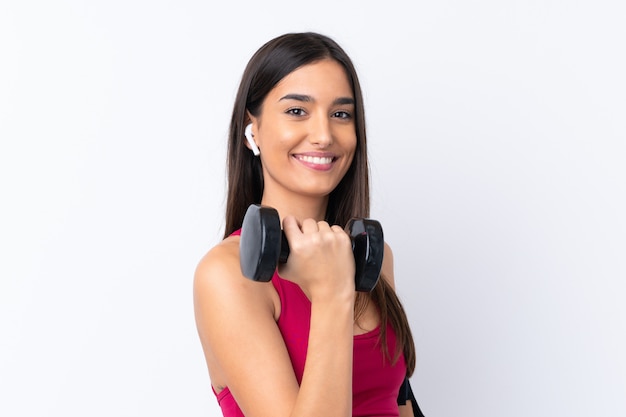 Young sport brunette woman over white making weightlifting