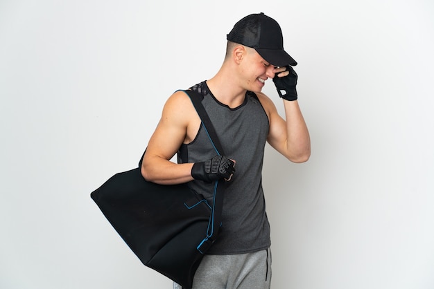 Young sport caucasian man with bag isolated