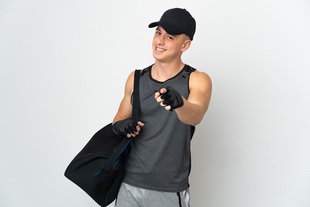 Young sport caucasian man with bag isolated