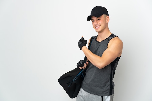 Young sport caucasian man with bag isolated