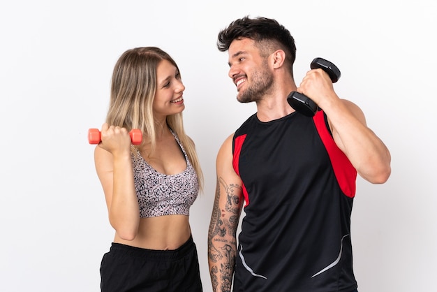 Young sport couple isolated on white background