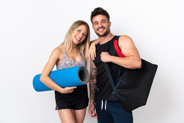 Young sport couple isolated on white background