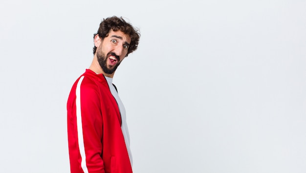 young sport dressed man feeling puzzled and confused