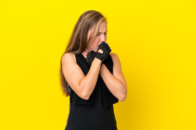 Young sport english woman isolated on white background is suffering with cough and feeling bad