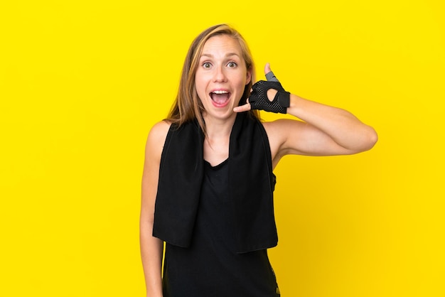 Young sport English woman isolated on white background making phone gesture. Call me back sign