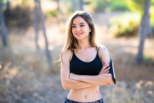 Young sport girl at outdoors happy and smiling