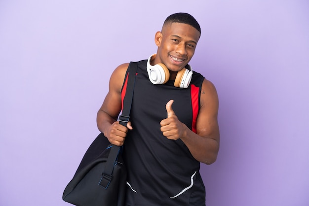 Young sport latin man with sport bag isolated