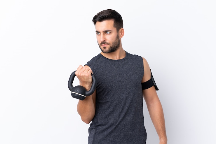 Photo young sport man over isolated wall 