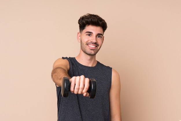 Young sport man making weightlifting