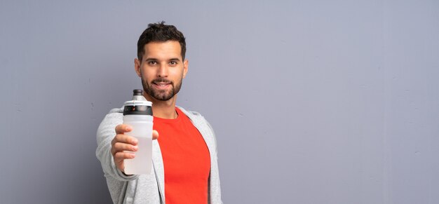 Young sport man with a bottle of water