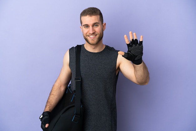 Young sport man with sport bag isolated