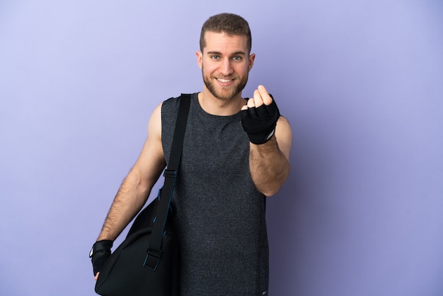 Young sport man with sport bag isolated