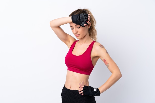 Young sport woman over isolated white wall with tired expression