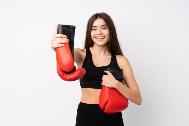 Young sport woman over isolated  with boxing gloves