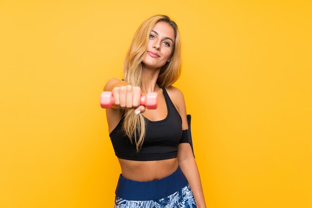 Young sport woman making weightlifting