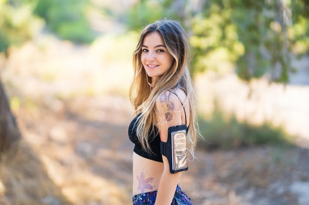 Young sport woman in a park at outdoors