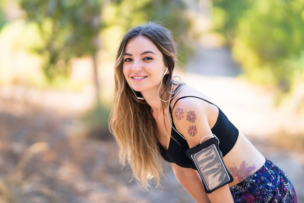 Young sport woman in a park at outdoors