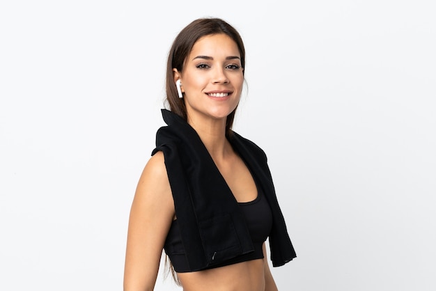 Young sport woman on white with sport towel