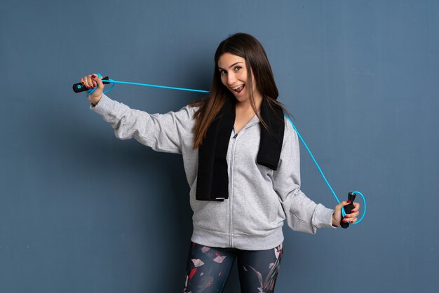 Young sport woman with jumping rope