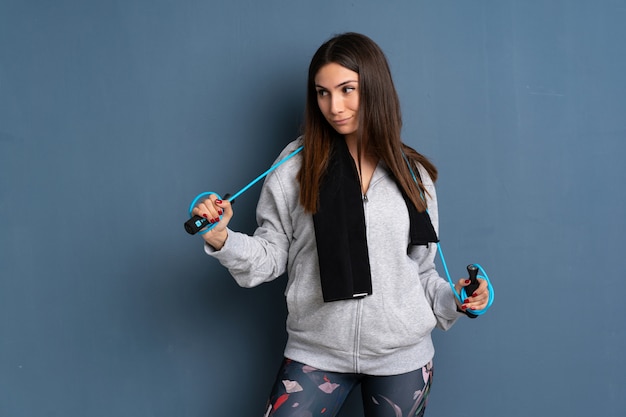 Young sport woman with jumping rope