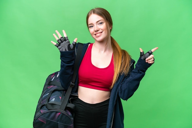 Young sport woman with sport bag over isolated chroma key background counting seven with fingers