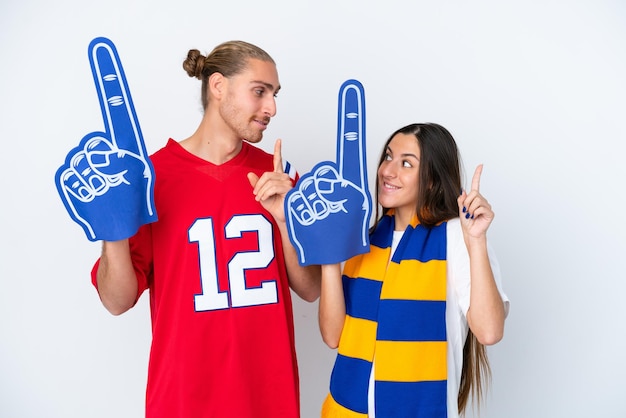 Young sports fan couple isolated on white background intending to realizes the solution while lifting a finger up