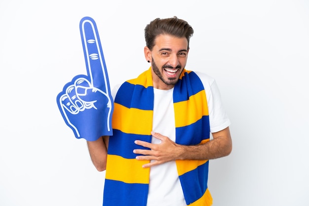 Young sports fan man isolated on white background smiling a lot